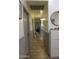 Hallway with wood-look tile flooring and modern wainscoting at 9732 N Penworth Dr, Casa Grande, AZ 85122