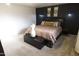 Main bedroom features a king bed, carpet, and stylish decor at 9732 N Penworth Dr, Casa Grande, AZ 85122