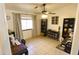 Home office featuring a ceiling fan, neutral paint and decorative touches at 9732 N Penworth Dr, Casa Grande, AZ 85122