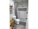 Walk-in shower featuring white marble tile, pebble floor, and rainfall shower head at 9732 N Penworth Dr, Casa Grande, AZ 85122