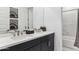 This bathroom features double sinks, quartz counters, and a shower with tiled surround at 9807 S 11Th St, Phoenix, AZ 85042