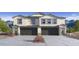 Beautiful new construction home with gray and white colors and two-car garage at 9807 S 11Th St, Phoenix, AZ 85042