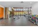 Modern gym featuring large windows, stone veneer walls, and a variety of weight lifting equipment at 9807 S 11Th St, Phoenix, AZ 85042