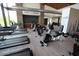 Fitness center featuring stationary bikes, treadmills and stone veneer walls at 9807 S 11Th St, Phoenix, AZ 85042