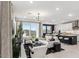 Bright and stylish living room featuring modern furniture, an open floor plan, and access to the backyard at 9807 S 11Th St, Phoenix, AZ 85042