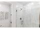 Contemporary shower stall features glass enclosure, modern hardware, and stylish marble wall at 9807 S 11Th St, Phoenix, AZ 85042