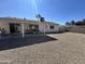 Large backyard with low maintenance landscaping and covered patio seating area at 2416 W Stottler Dr, Chandler, AZ 85224