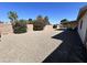 Backyard featuring desert landscaping, patio and seating area, and block fence at 2416 W Stottler Dr, Chandler, AZ 85224