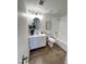 Neat bathroom features a vanity with storage, a large mirror, and a shower-tub combination at 2416 W Stottler Dr, Chandler, AZ 85224