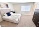 Inviting bedroom features a plush bed, neutral decor, and natural light from the window at 2416 W Stottler Dr, Chandler, AZ 85224
