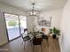 Cozy dining area with modern lighting and sliding door access to the outdoor patio at 2416 W Stottler Dr, Chandler, AZ 85224
