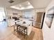 Bright kitchen features stainless steel appliances, ample counter space, and a functional center island with seating at 2416 W Stottler Dr, Chandler, AZ 85224