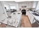 Stylish kitchen features granite countertops, stainless steel appliances, and a central island at 2416 W Stottler Dr, Chandler, AZ 85224