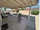 Covered patio featuring a seating area and bar, perfect for outdoor entertaining at 2416 W Stottler Dr, Chandler, AZ 85224