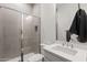 Modern bathroom featuring a glass-enclosed shower, neutral tile, and a sleek vanity at 3856 E Sagebrush St, Gilbert, AZ 85296