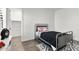 Well-lit bedroom features playful decor, a metal bed frame, and wood-look flooring at 3856 E Sagebrush St, Gilbert, AZ 85296