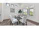 Bright dining room boasts natural light, modern light fixtures, and a stylish table set at 3856 E Sagebrush St, Gilbert, AZ 85296