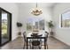 Dining room with tile floors and plantation shutters offers a lovely space for meals and gatherings at 3856 E Sagebrush St, Gilbert, AZ 85296