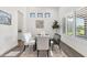 Bright dining area features natural light, an attractive rug, and modern decor elements at 3856 E Sagebrush St, Gilbert, AZ 85296