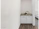 Hallway view of a white cabinet and countertop with decor elements at 3856 E Sagebrush St, Gilbert, AZ 85296