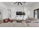 Comfortable living room with a large ceiling fan, modern furniture, and neutral color palette at 3856 E Sagebrush St, Gilbert, AZ 85296