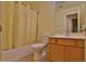 Cozy bathroom featuring a shower-tub combo, neutral tile flooring, and a single vanity at 803 W Burkhalter Dr, San Tan Valley, AZ 85143