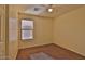 This bedroom has carpet flooring, natural light, and a ceiling fan at 803 W Burkhalter Dr, San Tan Valley, AZ 85143