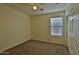 Comfortable bedroom with carpet, ceiling fan, and a window offering natural light at 803 W Burkhalter Dr, San Tan Valley, AZ 85143