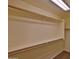 Functional walk-in closet providing ample storage space with shelving and rods at 803 W Burkhalter Dr, San Tan Valley, AZ 85143