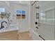 Bright bathroom with a shower over bath, and double sinks at 8215 E Virginia Ave, Scottsdale, AZ 85257
