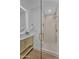 Bright bathroom featuring glass shower with gold fixtures and designer tile at 8215 E Virginia Ave, Scottsdale, AZ 85257