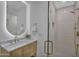 Bright bathroom with a glass shower with gold fixtures and a decorative alcove at 8215 E Virginia Ave, Scottsdale, AZ 85257