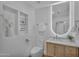 Bright bathroom with tile floors, and a toilet near a stylish vanity and a decorative alcove at 8215 E Virginia Ave, Scottsdale, AZ 85257