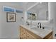 Bright bathroom featuring double sink vanity with white countertop and matte black fixtures and stylish decor at 8215 E Virginia Ave, Scottsdale, AZ 85257