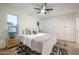 Bright bedroom with plush bedding, side table with lamp, and built-in closet, creating a relaxing and stylish retreat at 8215 E Virginia Ave, Scottsdale, AZ 85257