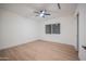 Bright bedroom with wood flooring, a ceiling fan, large window and modern design at 8215 E Virginia Ave, Scottsdale, AZ 85257