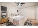Bright bedroom with plush bedding, side table with lamp, and built-in closet, creating a relaxing and stylish retreat at 8215 E Virginia Ave, Scottsdale, AZ 85257
