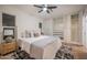 Bright bedroom with plush bedding, side table with lamp, and built-in closet, creating a relaxing and stylish retreat at 8215 E Virginia Ave, Scottsdale, AZ 85257