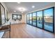 Bonus room features a bar, wood floors and folding doors that open to the pool at 8215 E Virginia Ave, Scottsdale, AZ 85257
