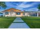 Charming single-story home with modern design, clean lines and landscaped front yard at 8215 E Virginia Ave, Scottsdale, AZ 85257