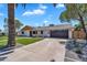 Beautiful home boasting a spacious driveway and modern design elements for curb appeal at 8215 E Virginia Ave, Scottsdale, AZ 85257