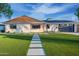 Charming single-story home with modern design, clean lines and landscaped front yard at 8215 E Virginia Ave, Scottsdale, AZ 85257