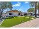 Charming single-story home featuring a well-manicured lawn and a modern exterior design at 8215 E Virginia Ave, Scottsdale, AZ 85257