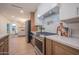 Stylish kitchen with stainless steel appliances, range hood, and modern countertops at 8215 E Virginia Ave, Scottsdale, AZ 85257