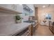 Updated kitchen featuring modern countertops, range and oven, and stylish cabinetry at 8215 E Virginia Ave, Scottsdale, AZ 85257