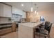 Stylish kitchen features stainless appliances and marble island with seating at 8215 E Virginia Ave, Scottsdale, AZ 85257