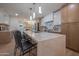 Bright kitchen with modern lighting and marble countertops with seating at 8215 E Virginia Ave, Scottsdale, AZ 85257