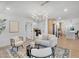 Bright living room featuring a designer rug, modern furniture, and open access to the kitchen at 8215 E Virginia Ave, Scottsdale, AZ 85257