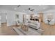 Bright living room featuring a contemporary design and an open concept layout to kitchen at 8215 E Virginia Ave, Scottsdale, AZ 85257