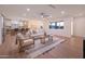 Bright living room with hardwood floors, a ceiling fan, and modern furnishings at 8215 E Virginia Ave, Scottsdale, AZ 85257